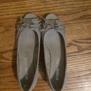 Tan opened toe flats.